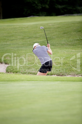 woman is playing golf on course  summer