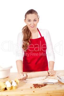beautiful woman is baking cookies for christmas