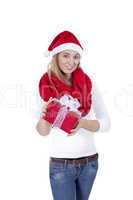 young smiling girl with red hat and present christmas