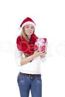 young smiling girl with red hat and present christmas