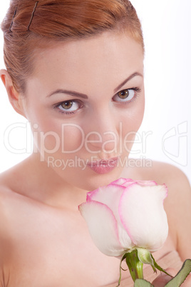 beautiful young woman holding pink rose isolated