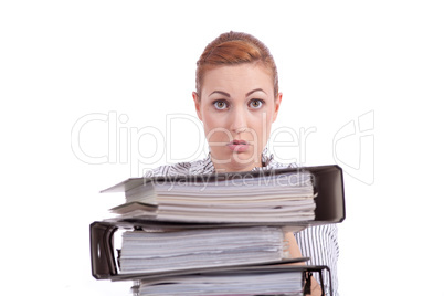 business woman in office looks at unbelievable folder stack
