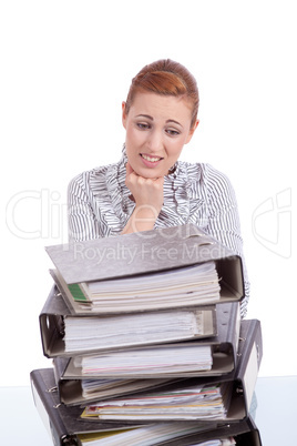 business woman in office looks at unbelievable folder stack