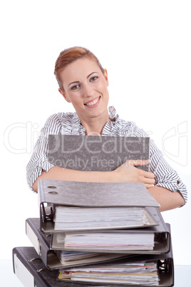 business woman in office looks at unbelievable folder stack