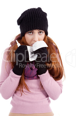 woman with tissue and spray feels unwell with flu
