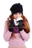 woman with tissue and spray feels unwell with flu
