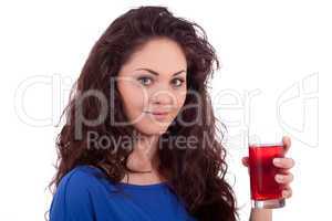 beautiful smiling brunette woman is drinking red juice