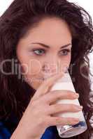 beautiful smiling woman is drinking milk