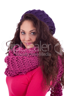 beautiful young smiling girl with hat and scarf in winter