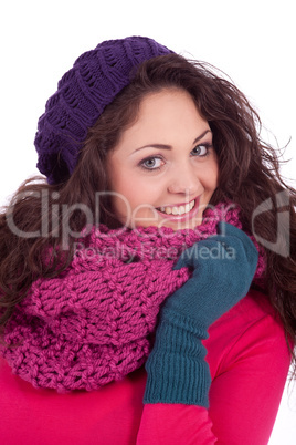 beautiful young smiling girl with hat and scarf in winter