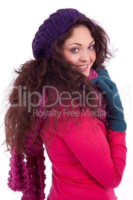 beautiful young smiling girl with hat and scarf in winter