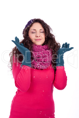 beautiful smiling brunette woman in snow in winter