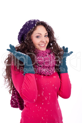 beautiful smiling brunette woman in snow in winter