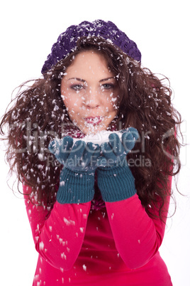 beautiful smiling brunette woman in snow in winter