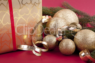 beautiful golden christmas decoration on red background