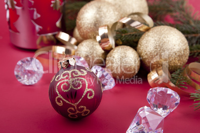 beautiful golden christmas decoration on red background