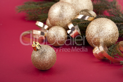 beautiful golden christmas decoration on red background