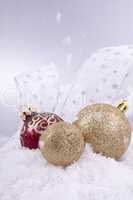 beautiful gold and red christmas decoration on white snow
