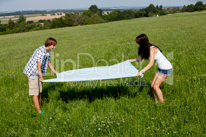 young couple outdoor in summer on blanket in love young couple outdoor in summer on blanket in love