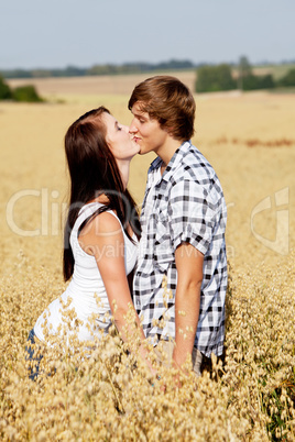 happy couple in love outdoor in summer on field