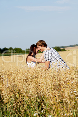 happy couple in love outdoor in summer on field