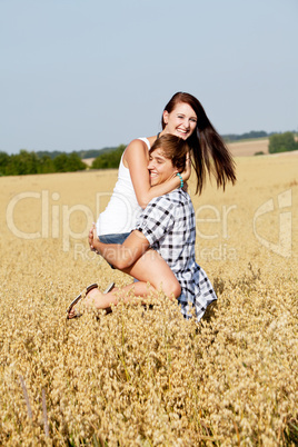 happy couple in love outdoor in summer on field