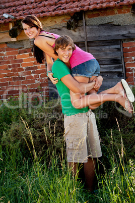 young couple in love having fun in summer outdoor