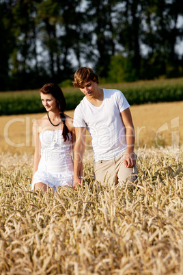 happy couple in love outdoor in summer on field