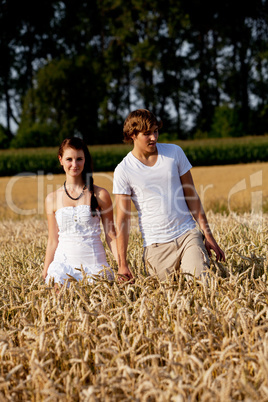 happy couple in love outdoor in summer on field