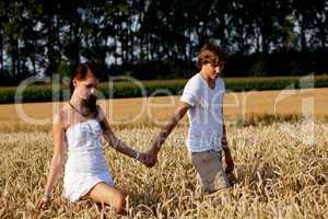 happy couple in love outdoor in summer on field