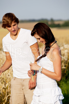 happy couple in love outdoor in summer on field