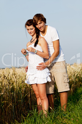 happy couple in love outdoor in summer on field