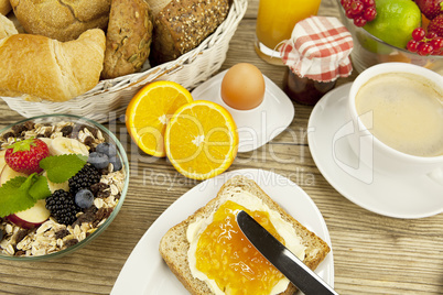 tasty breackfast with toast and marmelade on table