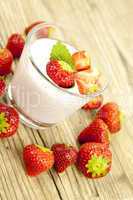 fresh tasty strawberry yoghurt shake dessert on table