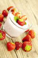 fresh tasty strawberry yoghurt shake dessert on table