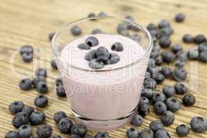 fresh delicious blueberry yoghurt shake dessert on table
