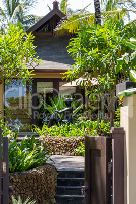 Stone wall and balustrade with a gated entrance