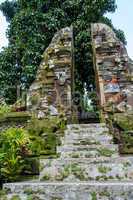 Ornate column in formal Balinese garden