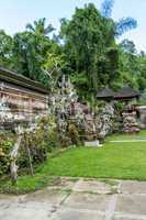 Ornate column in formal Balinese garden