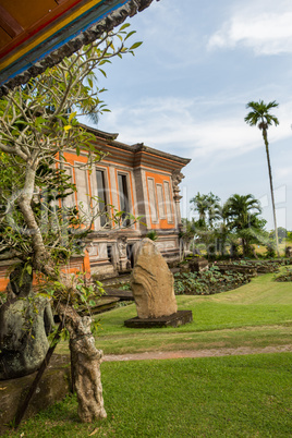 Ornate column in formal Balinese garden