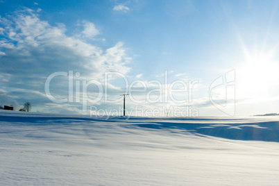 beautiful sunny landscape in winter with blue sky