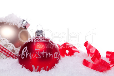 christmas decoration festive red bauble in snow isolated