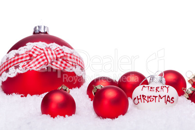 christmas decoration festive red bauble in snow isolated