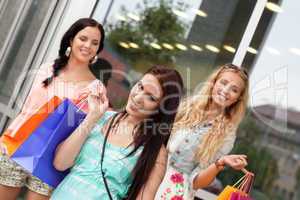 two attractive young girls women on shopping tour