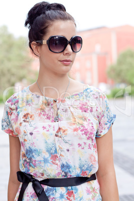 attractive woman with sunglasses in the city summertime