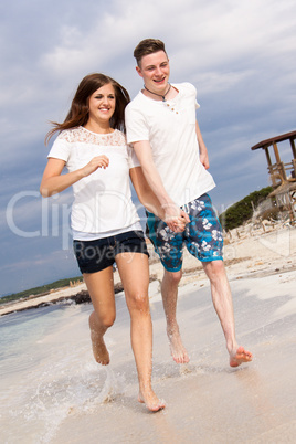 happy young couple on the beach in summer holiday love