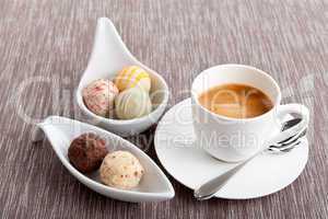 sweet delicious truffle pralines chocolate and hot espresso coffee