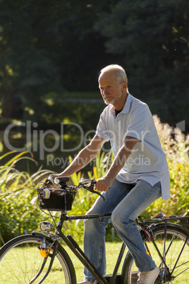 Senior Man Riding Bicycle