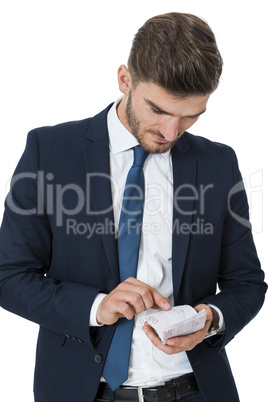 Wealthy successful businessman burning money