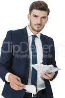 Wealthy successful businessman burning money